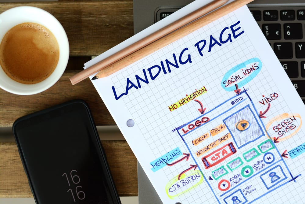 Landing Page graph paper with laptop and coffee